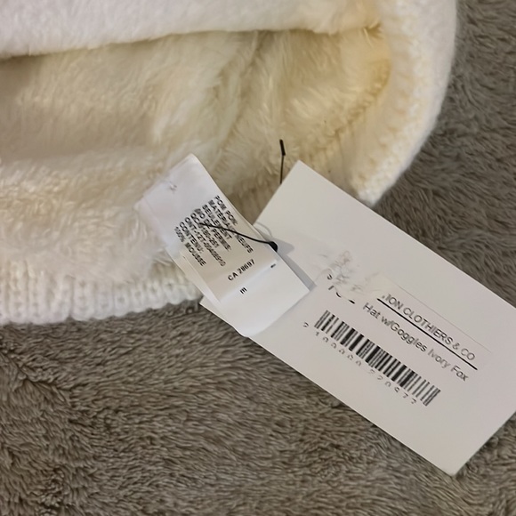 Revolution clothiers and co toboggan with ski goggles built in. Cream fur puff. - Picture 2 of 4